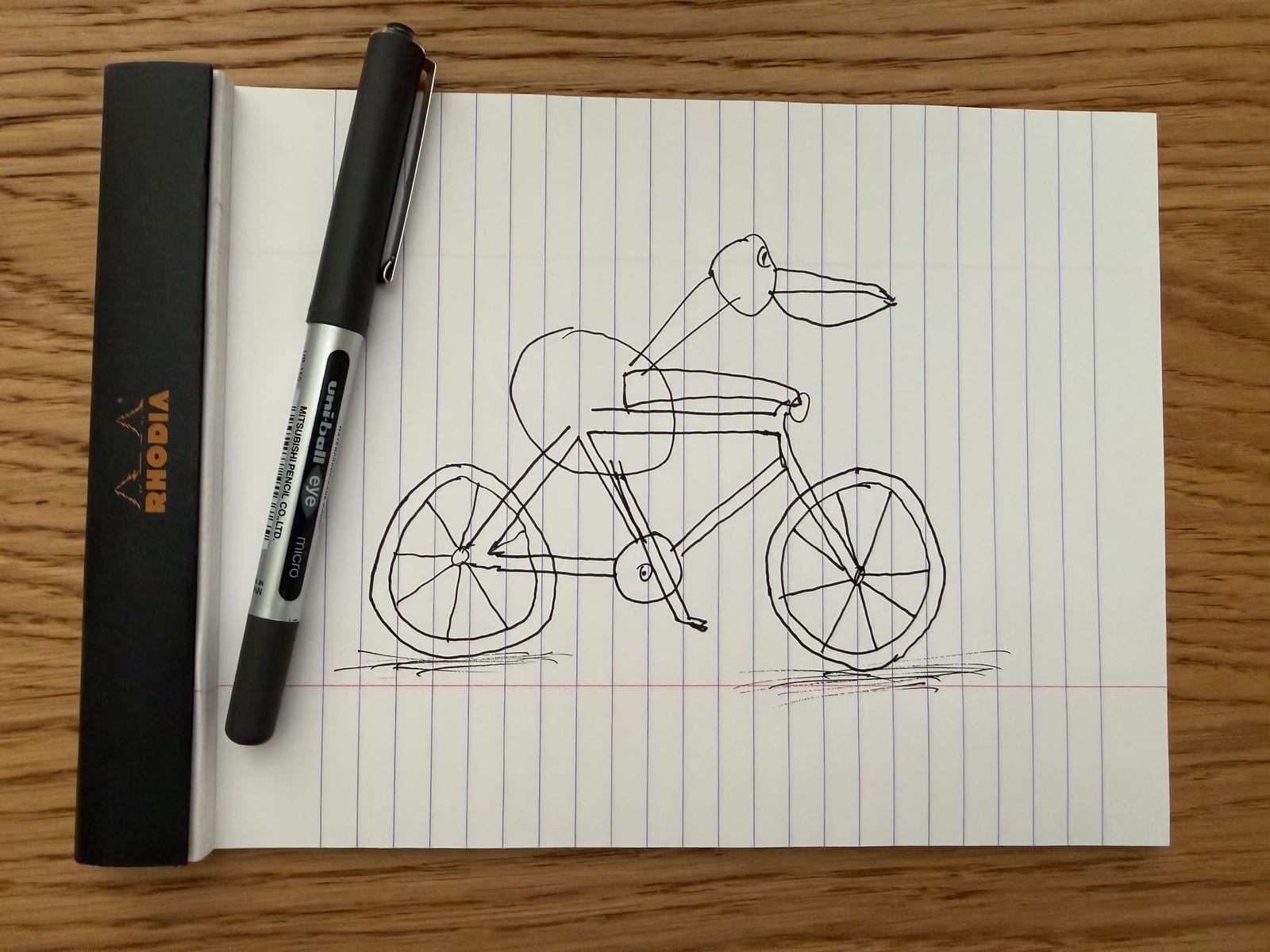 JCT-1's drawing of a pelican riding a bicycle